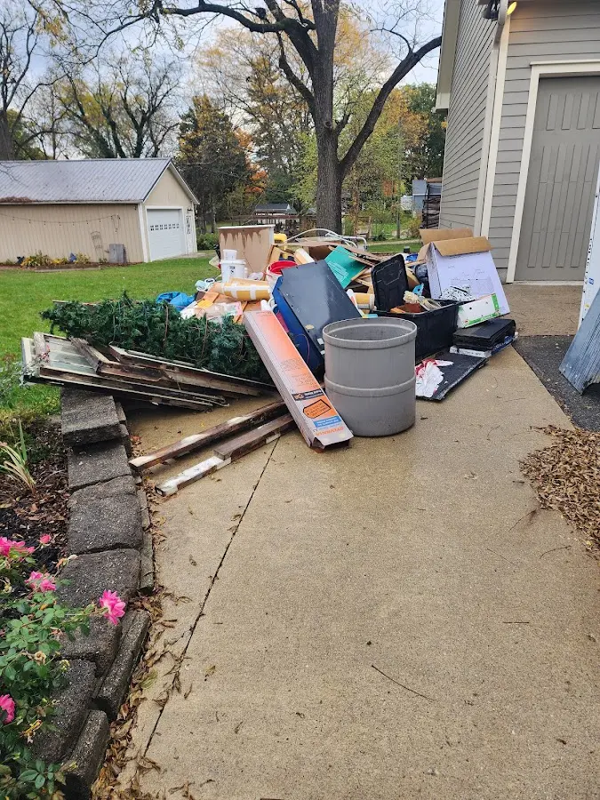 Dumpster being loaded with debris for Roofing Dumpster Rental in Hortonville